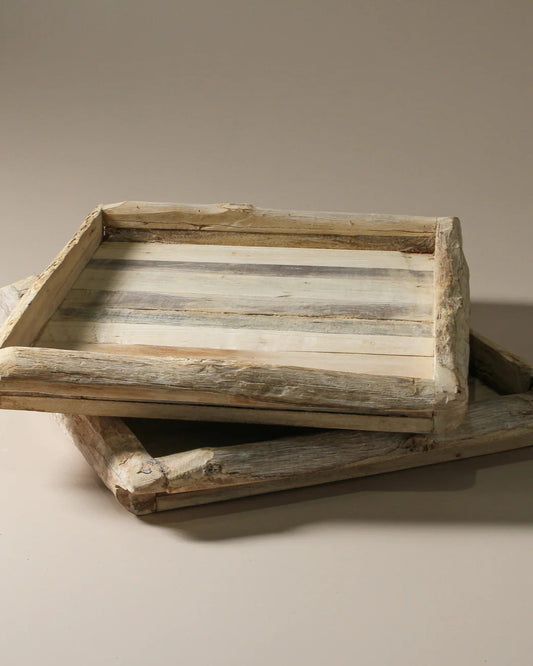 Wooden tray with a rustic design on a beige background